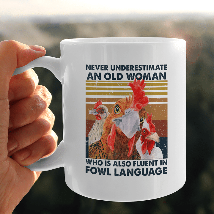 Never Underestimate An Old Woman Who Is Also Fluent In Fowl Language Mug