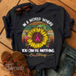 In A World You Can Be Anything Be Kind Breast Cancer Awareness 2024 Graphic Unisex T Shirt, Sweatshirt, Hoodie Size S - 5XL