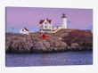 USA, Maine, York Beach. Nubble Light lighthouse at dusk