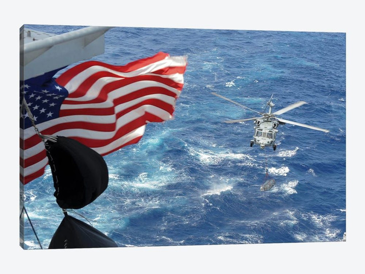 An MH-60S Sea Hawk Carries Supplies During A Replenishment At Sea