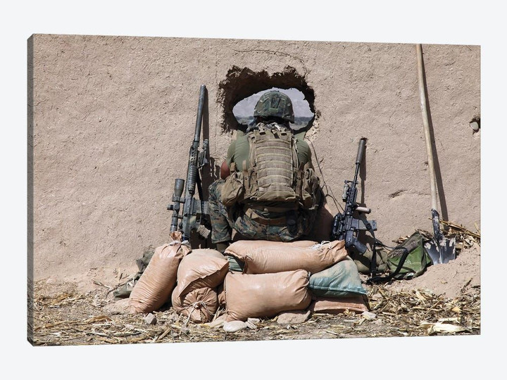 A US Marine Sniper Observes His Sector At A Patrol Base Near Sangin, Afghanistan