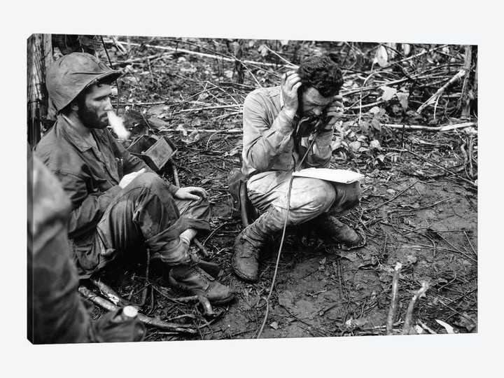 An Officer Receives A Report On A Field Radio In The Battlefield