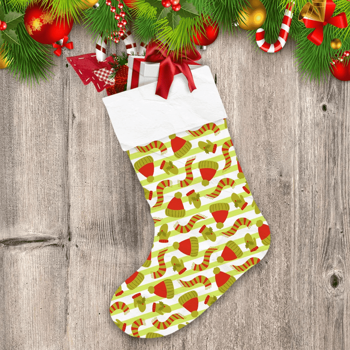 Green Striped Background Pattern With Winter Clothing Christmas Stocking