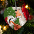 Alaskan Malamute and Santa Clause With Candy Cane Christmas Ceramic Ornament