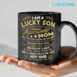 I Am A Lucky Son Because I’m Raised By A Freaking Awesome Mom If You Mess With Me She’ll Punch You In The Face Very Hard Black Coffee Mug Funny Gift For Son From Mother Son Mug Gift For Him