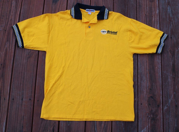 Vintage 90s Bristol Motor Speedway Collared Polo T Shirt   Size M   Checkered Sleeves and Collar   Yellow NASCAR Food City 500