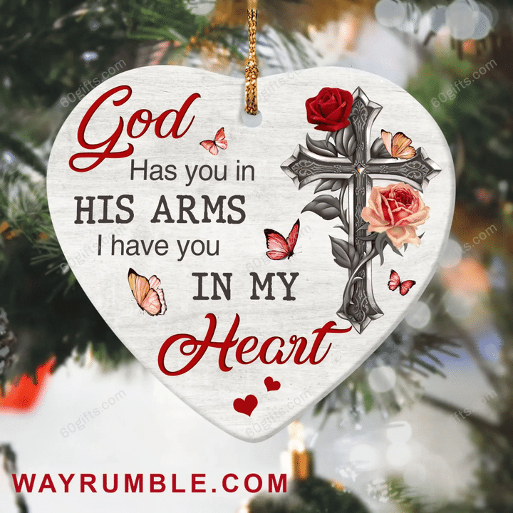 Jesus Has You In His Arm Christmas Heart Ceramic Ornament - Christmas Gift For Family, For Her, Gift For Him Two Sided Ornament