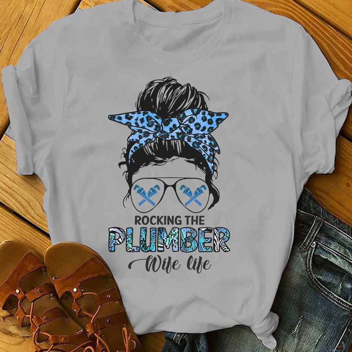 Plumber Wife Life T-Shirt - Woman wearing black tee with white text 'ROCKING THE PLUMBER WIFE LIFE' - Supportive Apparel for Plumbers' Wives