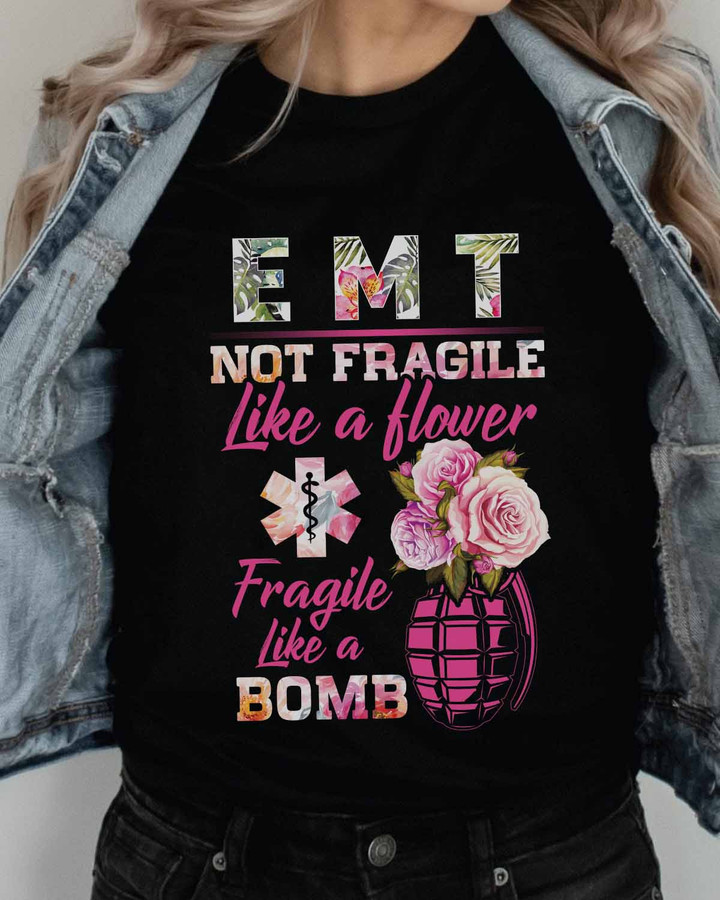Black EMT t-shirt with white text, featuring feminist quote 'Not fragile like a flower, fragile like a bomb.'
