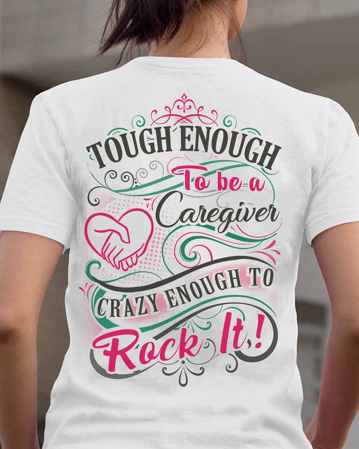 White caregiver t-shirt with bold black font, featuring the quote 'Tough enough to be a caregiver, crazy enough to rock it!'