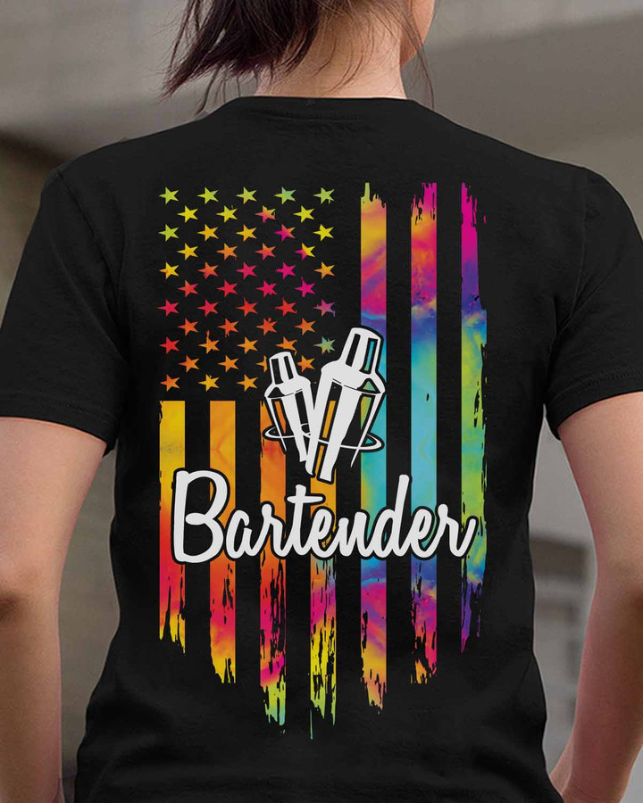 Black t-shirt with tie-dye American flag design and 'Bartender' word written in white, ideal for blue-collar workers in the bartender profession.