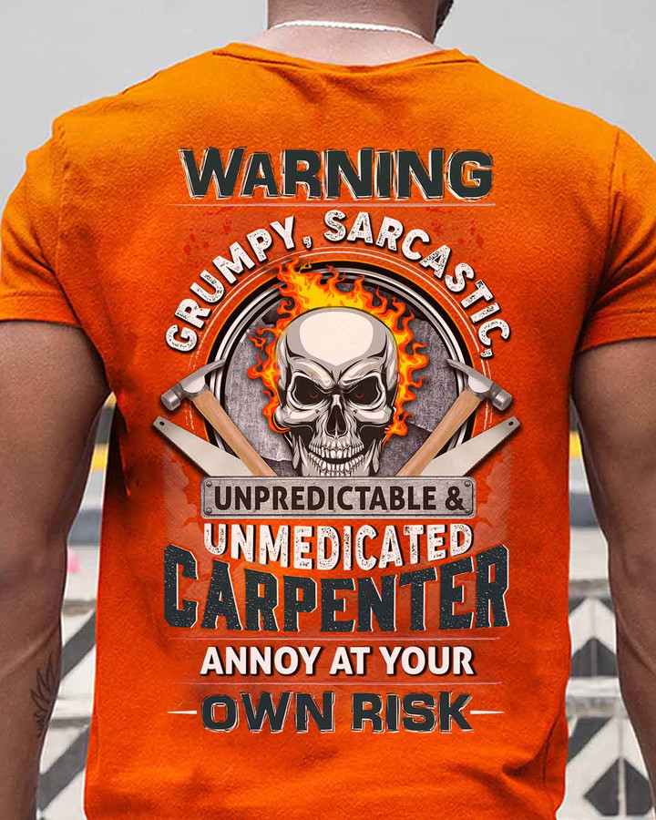 Orange t-shirt with bold text: "SARCASTIC, GRUMPY, UNPREDICTABLE & UNMEDICATED CARPENTER. ANNOY AT YOUR -OWN RISK-". Perfect for carpenters who aren't afraid to speak their minds.