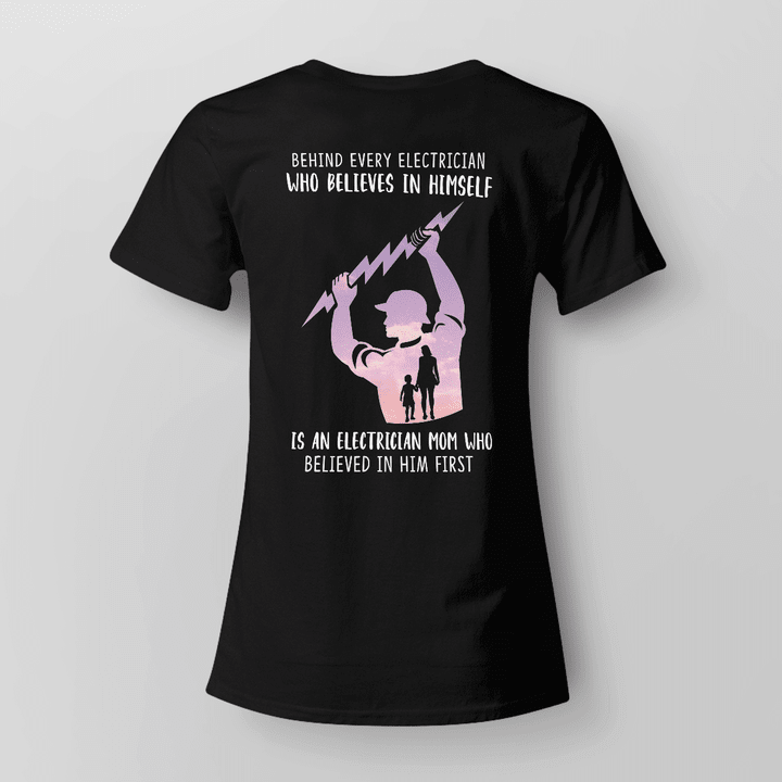 Black cotton t-shirt with quote 'Behind every electrician who believes in himself is an electrician mom who believed in him first,' honoring electricians and their supportive mothers.