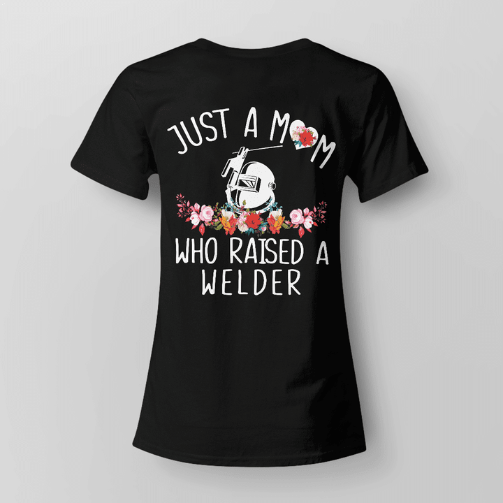 Black t-shirt with white text 'Just a mom who raised a welder', representing love and support for the welder profession.