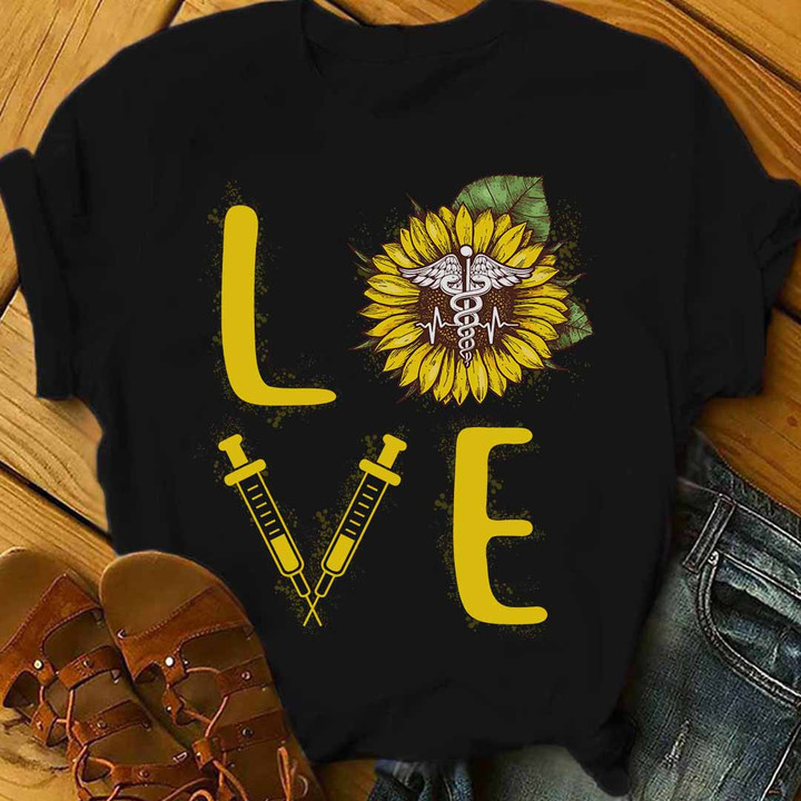 Nurse t-shirt with sunflower and syringe graphic design, perfect for expressing passion for the nursing profession.