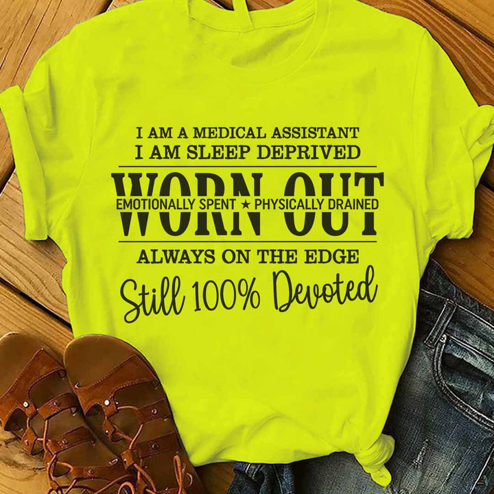 Black t-shirt for medical assistants with white text graphic featuring relatable quote about the challenges and dedication of the profession.