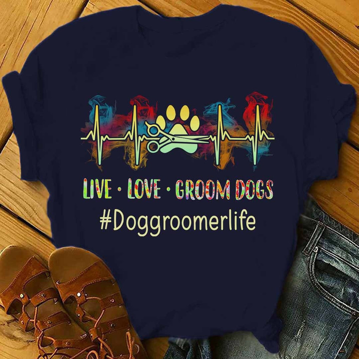 Navy blue t-shirt for dog groomers with 'LIVE LOVE GROOM DOGS' quote in hashtag format, symbolizing the passion of #Doggroomerlife.