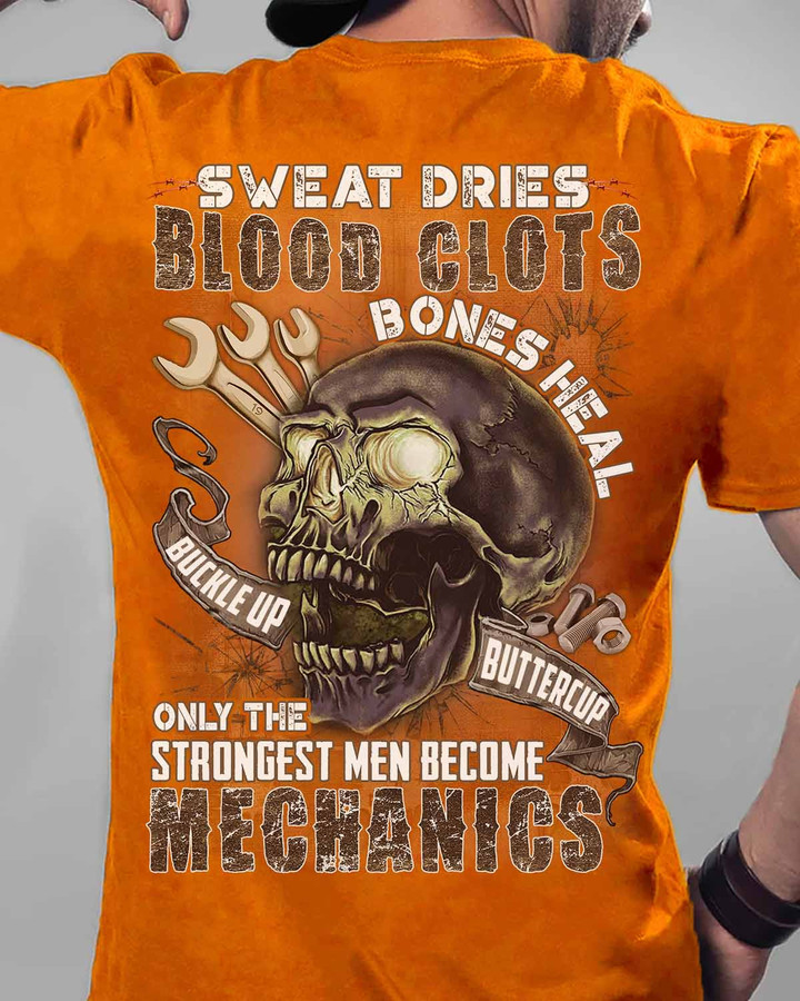 Bright orange mechanic t-shirt with a powerful quote and skull and wrench design, symbolizing resilience and strength in the mechanic profession.