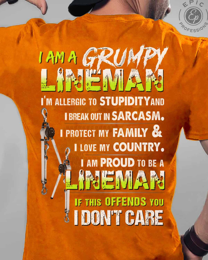 Orange Grumpy Lineman T-Shirt, showcasing a quote about sarcasm, protecting family, and love for country.