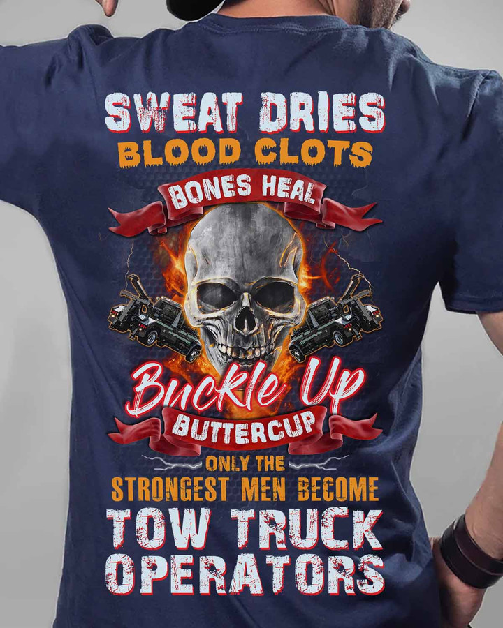 White t-shirt with graphic of skull wearing tow truck crown, quote 'ONLY THE STRONGEST MEN BECOME TOW TRUCK OPERATORS' – ideal for tow truck operators.