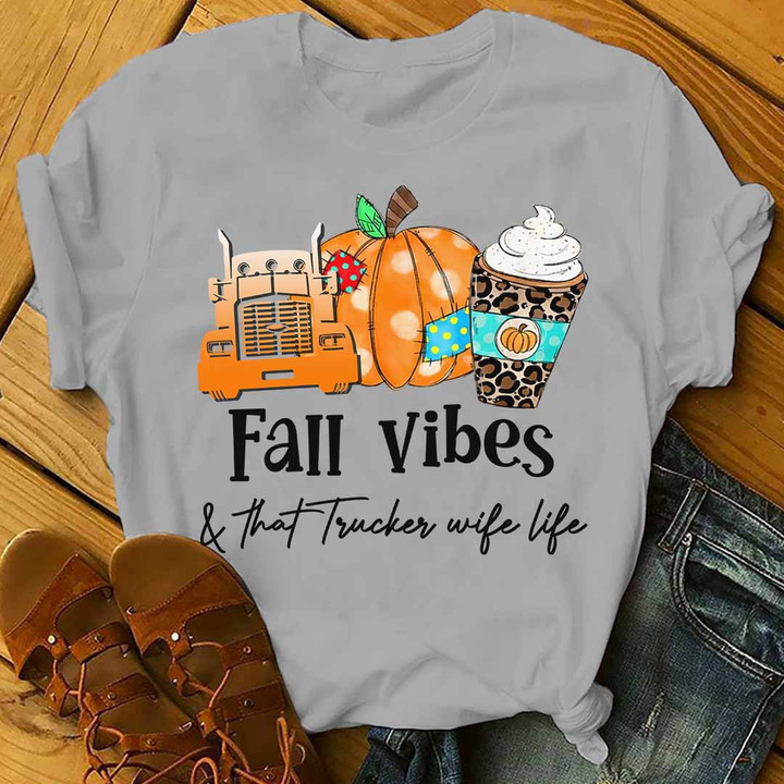 Gray T-shirt with a pumpkin, truck graphic, and the quote "Fall vibes and that trucker wife life" for trucker wives.