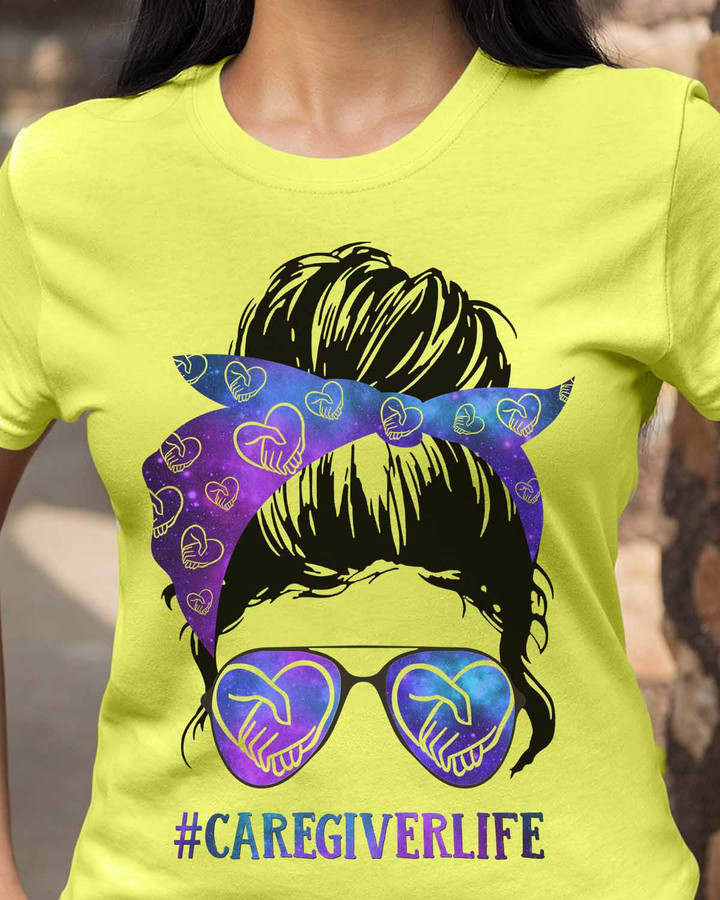 Yellow caregiver t-shirt with purple bandana and sunglasses showcasing the #CAREGIVERLIFE.