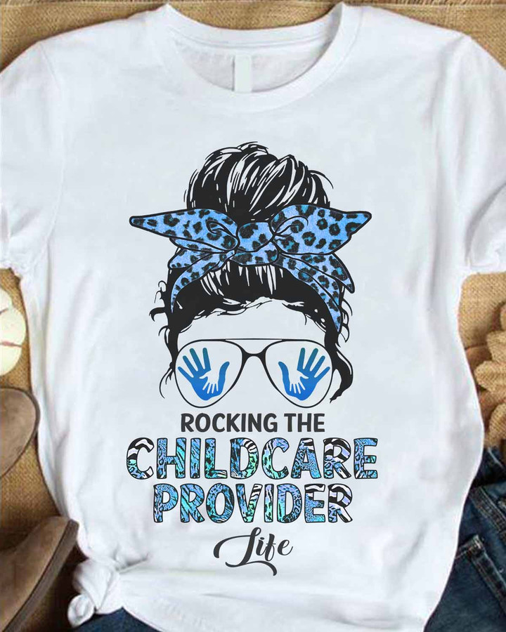 White t-shirt with blue leopard print headband and sunglasses, perfect for rocking the Childcare Provider life.