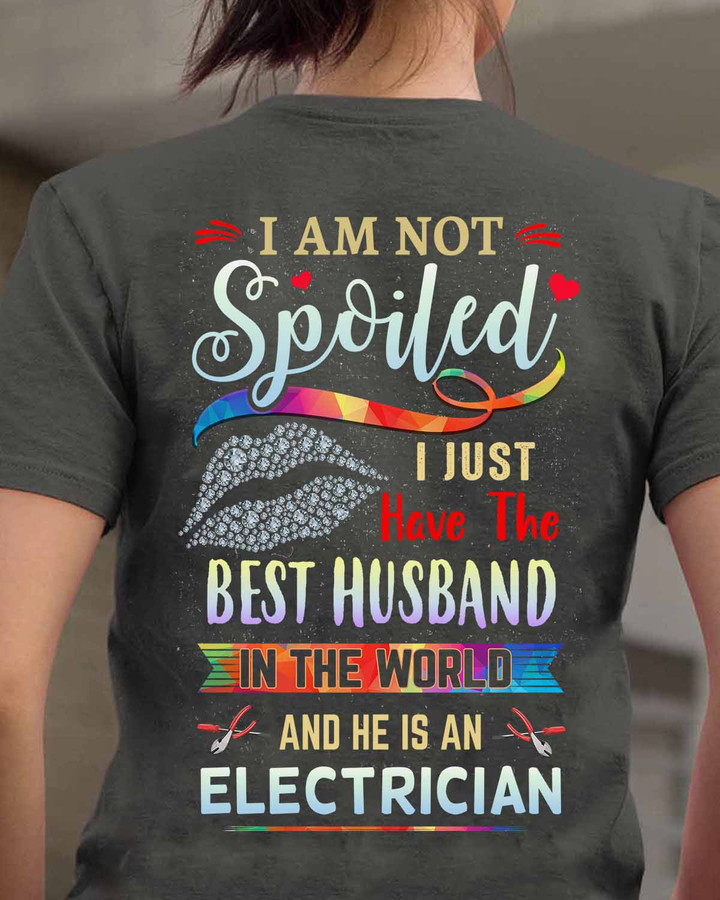 White t-shirt with black text that reads 'I am not spoiled, I just have the best husband in the world and he is an electrician' - a funny and loving tribute to electricians.