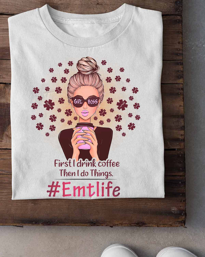 EMT Coffee Graphic T-Shirt - Woman holding a cup of coffee, representing the confidence and determination of a girl boss in the emergency medical services field.