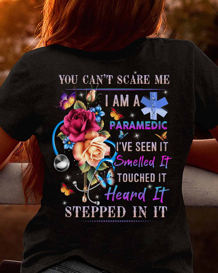 Black paramedic t-shirt with stethoscope and flower graphic design, representing courage and resilience