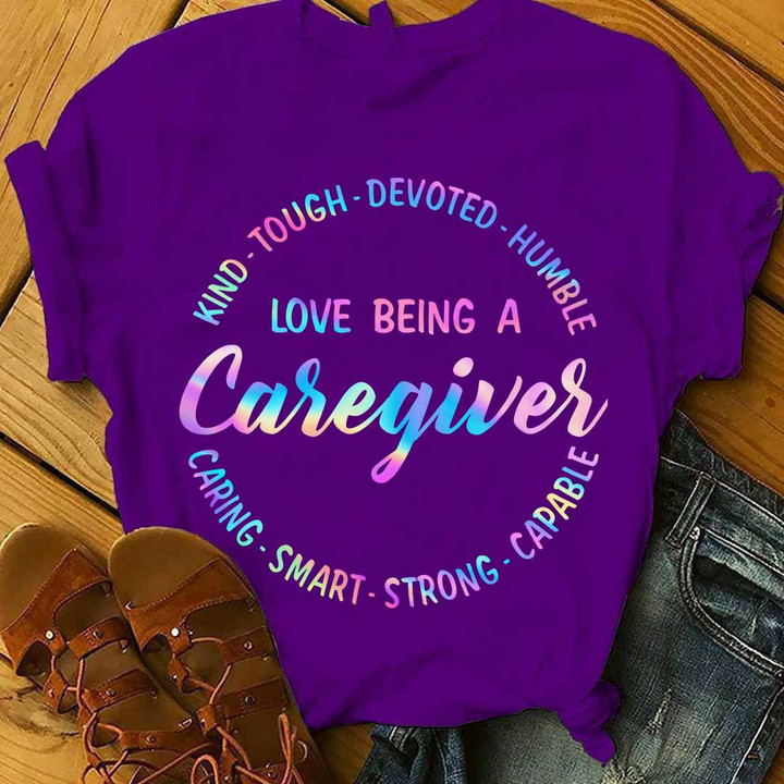 Purple t-shirt for caregivers with the quote "I love being a caregiver" in white letters.