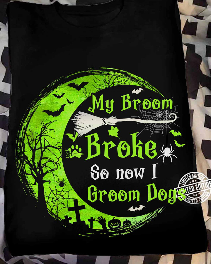 Dog Groomer T-Shirt - Black tee with broom and spider web graphic, ideal for dog grooming enthusiasts.