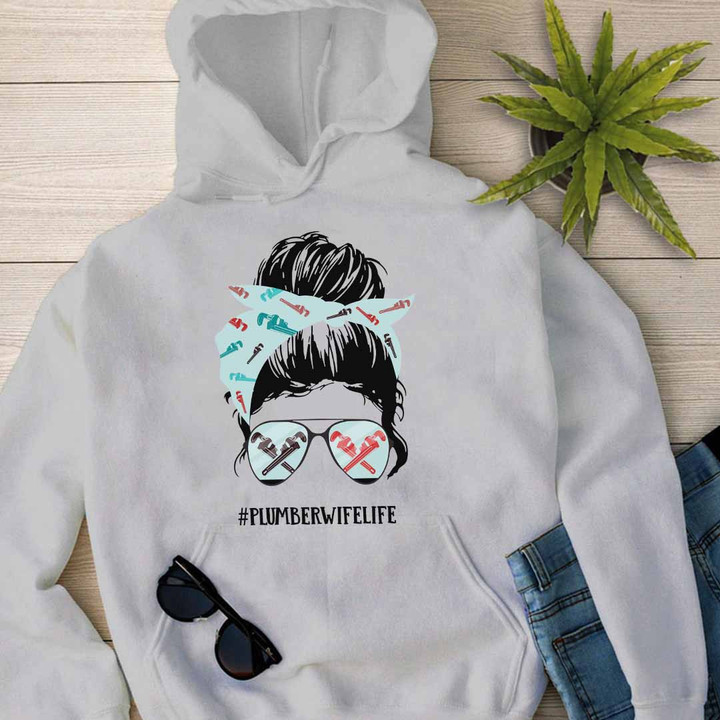 Graphic design of a woman in sunglasses and bandana on a white hoodie - "#PLUMBERWIFELIFE"