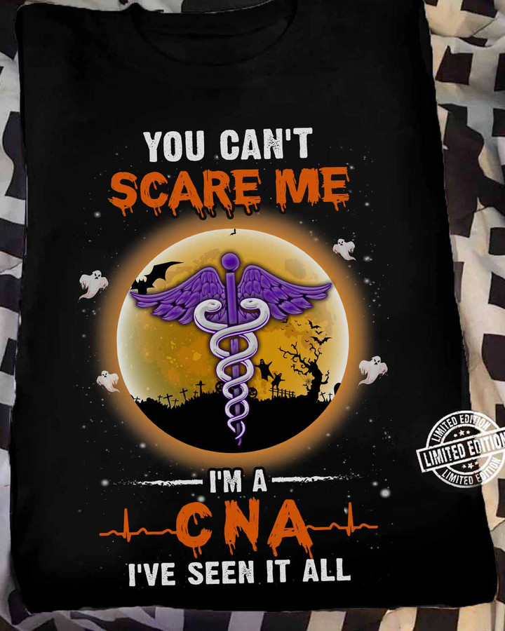 Black CNA t-shirt with white caduceus graphic and quote 'YOU CAN'T SCARE ME. I'M A CNA I'VE SEEN IT ALL.'