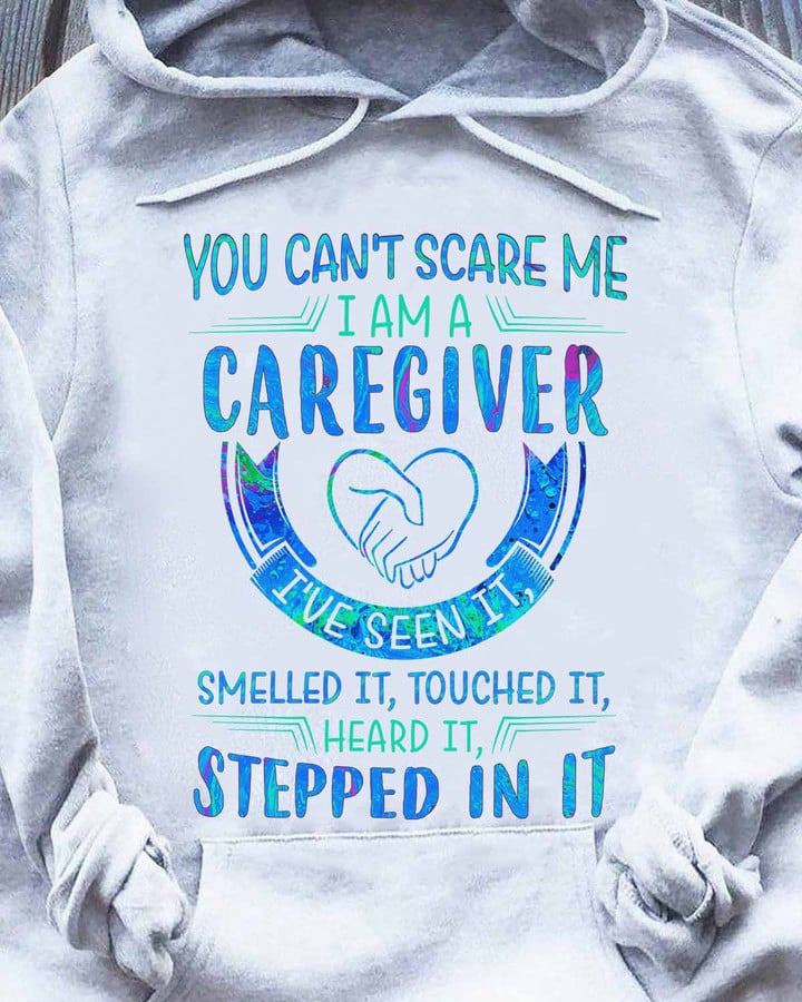 Black caregiver hoodie with bold white text - You can't scare me, I am a caregiver.