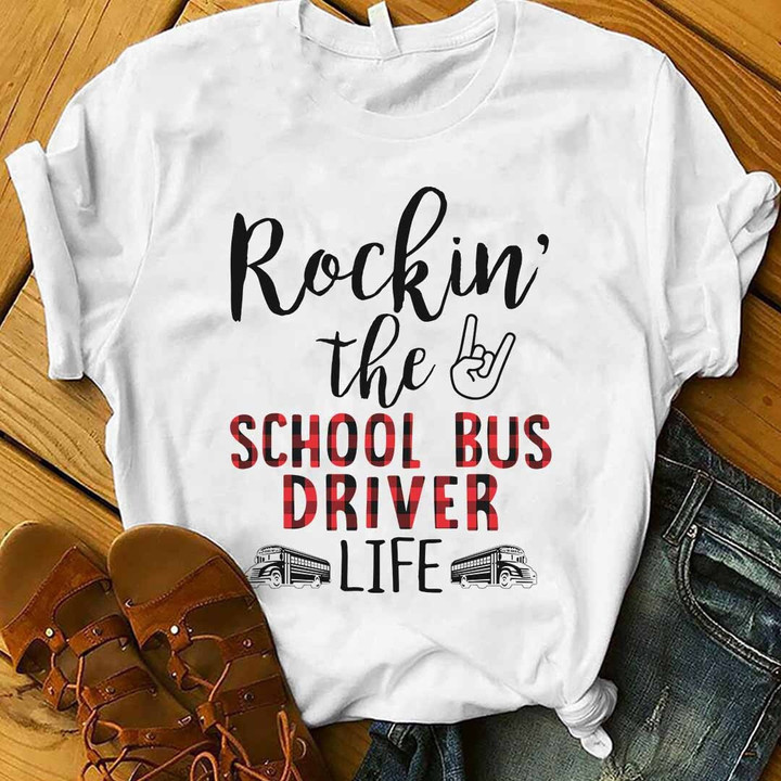White t-shirt for school bus drivers with the quote 'Rockin' the by school bus driver life' and a school bus icon. Show your pride as a school bus driver.