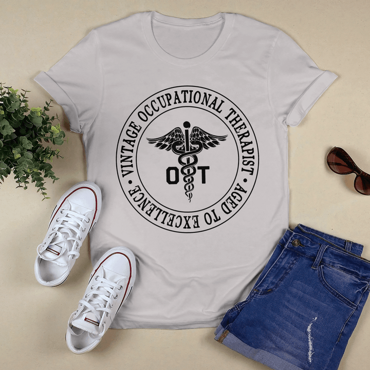 Occupational therapist t-shirt with caduceus symbol and the quote "I am here to help"