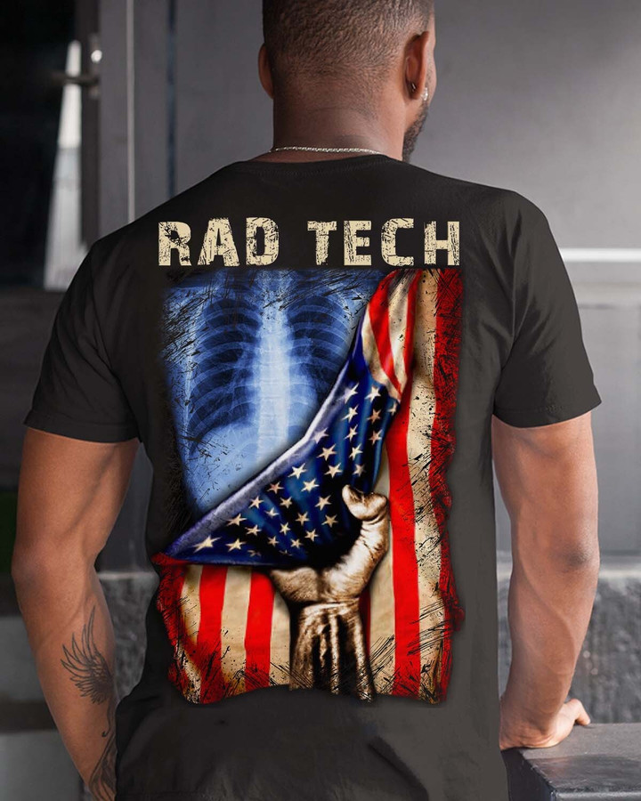 Graphic design of hand holding an American flag on a black t-shirt for rad tech professionals