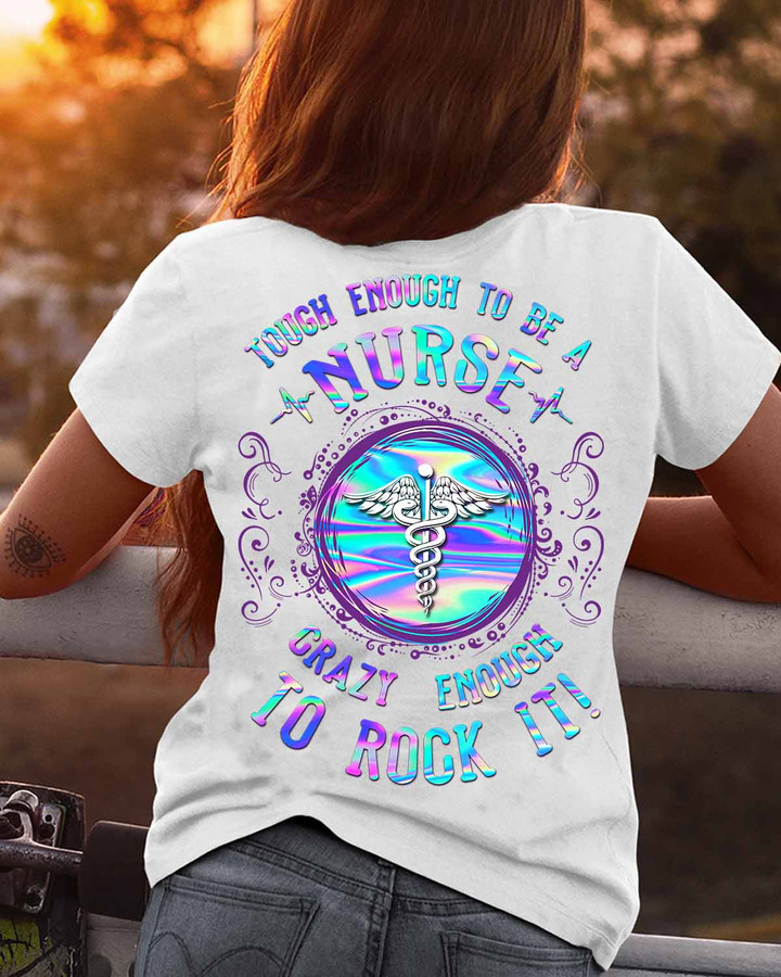 White t-shirt with caduceus symbol and quote 'Tough Enough to Be a Nurse, Crazy Enough to Rock It!' for nurses to showcase their dedication and passion.