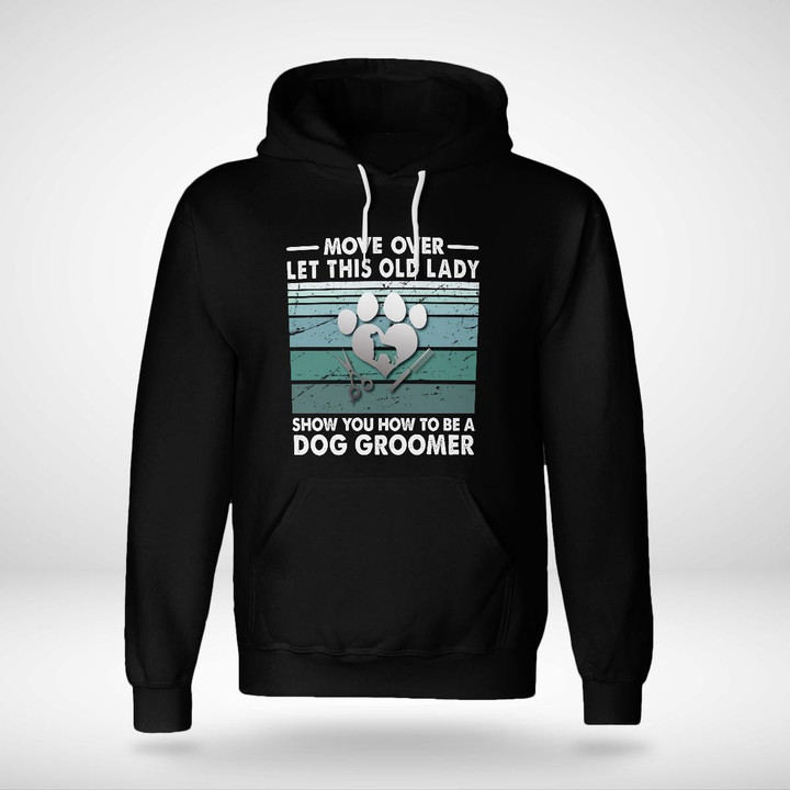 Black hoodie for dog groomers with the quote 'Move over, let this old lady show you how to be a dog groomer.'