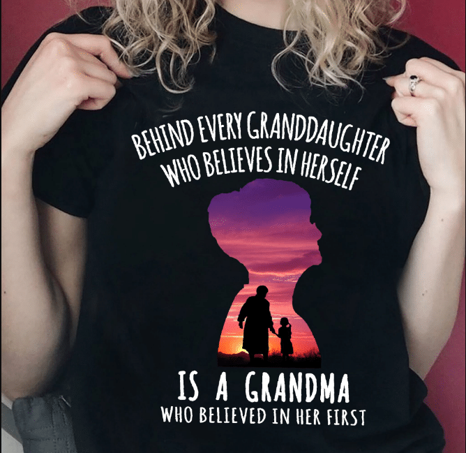 Behind Every Granddaughter Who Believes In Herself Is A Grandma T-Shirt - ATMTEE
