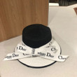 Christian Dior Logo Print In White Band Knotted Bow Bucket Hat In Black