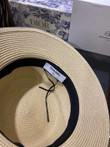 Chanel White Logo Embossed On Black Band Bucket Hat In Cream