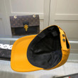 Chanel Cc Logo Embroidered Baseball Cap In Orange And Gold