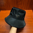 Prada Black Nylon Bucket Hat With Black Metal Logo