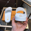 Louis Vuitton Waterfront Mule Slides In White And Gold Monogram