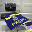 Prada Milano Letter And Logo Wool Beanie In Navy Yellow