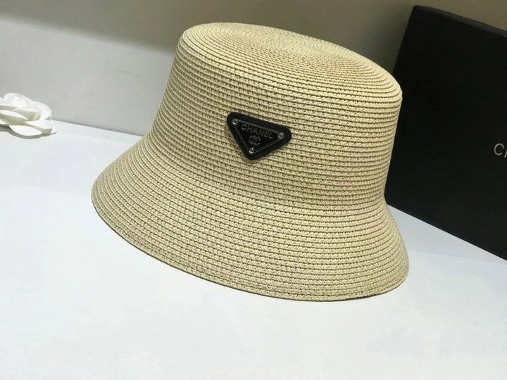 Chanel Logo Embossed On Triangle Leather Bucket Hat In Beige