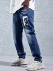 Men Figure & Letter Graphic Slant Pocket Jeans