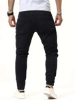 Men Solid Distressed Ripped Jeans